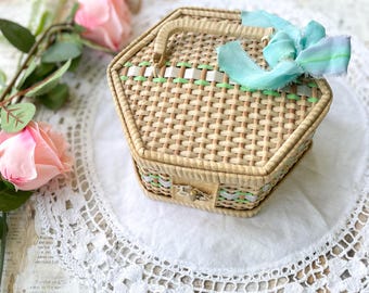 Vintage wicker sewing basket with notions and trinkets