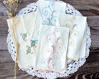 Vintage embroidered table napkins with a paisley pattern