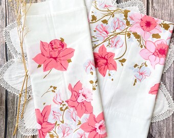 Vintage pair of standard pillowcases with retro pink and pale blue flowers