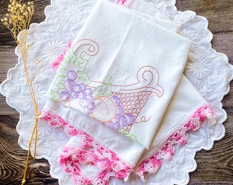 Vintage embroidered tablecloth with pink edging
