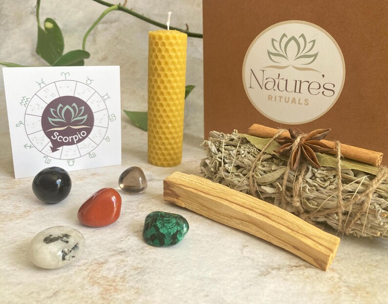 May include: A zodiac kit for Scorpio featuring a beeswax candle, sage smudge stick, palo santo stick, and crystals. The kit also includes a card with the zodiac symbol and the word "Scorpio".