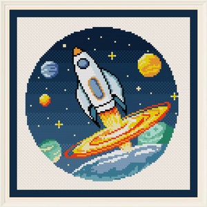 May include: A white rocket ship with a blue window blasts off into space. The rocket is surrounded by planets and stars in a dark blue sky. The rocket's exhaust is a bright orange and yellow.