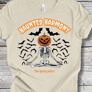 Haunted Harmony Halloween Jersey Short Sleeve Tee, Spooky Pumpkin Skeleton in Meditation Pose T-shirt