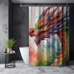 May include: A colorful watercolor shower curtain featuring a dragon's head. The dragon is depicted with vibrant hues of red, orange, yellow, green, blue, and purple. The dragon's mouth is open, revealing sharp teeth.