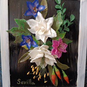 Realistic flowers, realistic roses, handmade decoration with cold ceramics on top of a frame