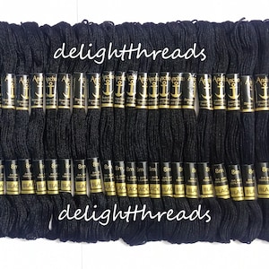 May include: A collection of black embroidery floss skeins. Each skein is labeled with the brand name and the word "BLACK". The text "delightthreads" is written across the top and bottom of the image.