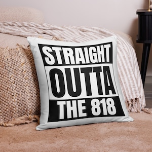 May include: White pillow with black text that reads "STRAIGHT OUTTA THE 818".