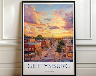 May include: A framed wall art print featuring a sunset view of a town street in Gettysburg, Pennsylvania. The scene depicts brick buildings, trees, and cars on a road under a vibrant orange and purple sky. The text Gettysburg Pennsylvania is below.