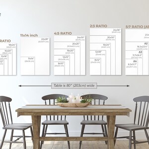 a dining room with a wooden table and four chairs. Above the table, there is a wall with five framed size charts displaying the dimensions of various table sizes in inches. The charts provide a visual representation of the table's width in both 3/4" and 5/8" sizes.