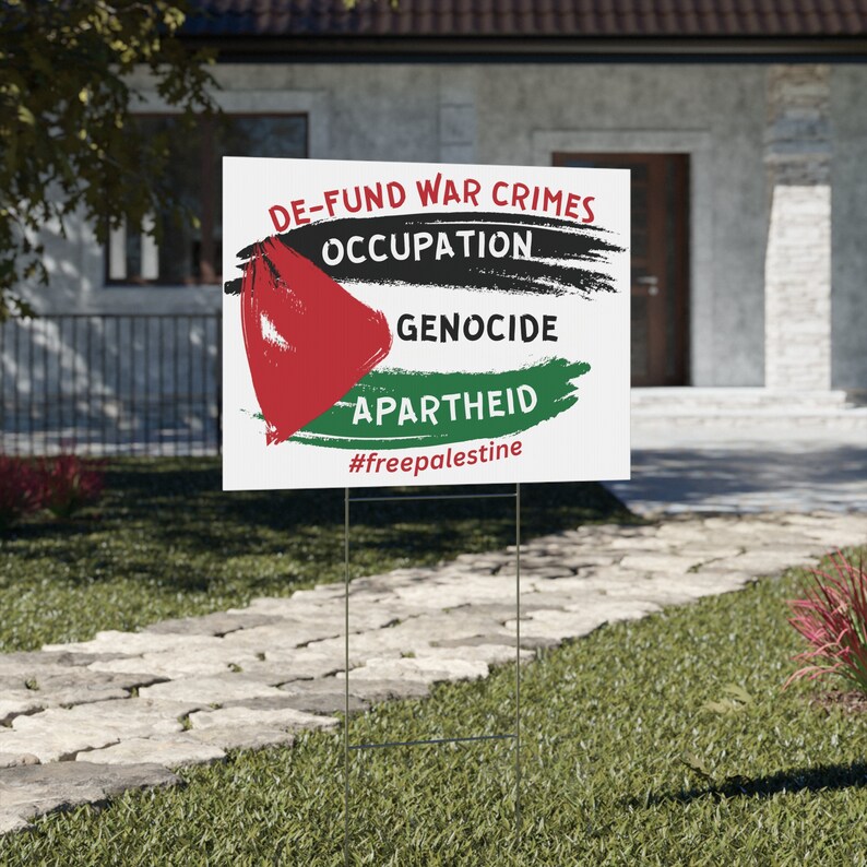 Palestine yard sign or Palestine protest sign that has the Palestinian flag and it says defund war crimes, occupation, geocide and apartheid. Free Palestine