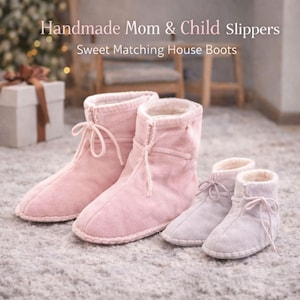 May include: Pink handmade mom and child house boots. The boots have a soft, suede-like texture and a warm, fluffy interior. The boots are tied with a matching string. The text on the image reads: Handmade Mom & Child Slippers Sweet Matching House Boots.