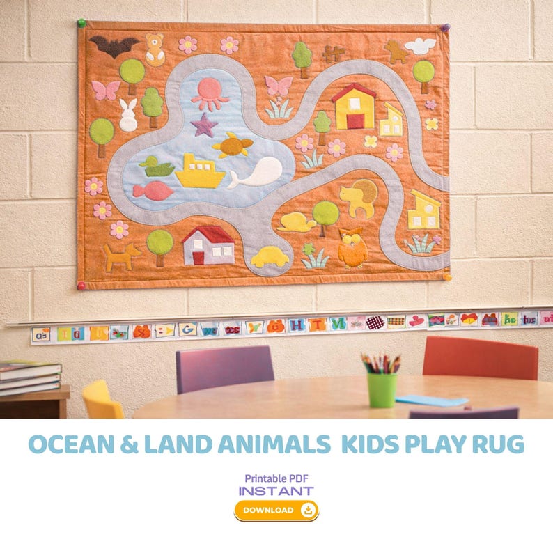 May include: A quilted play rug featuring a road and water design with ocean and land animal appliqu&eacute;s. The rug is orange with a gray road, a blue water area, and various animal and flower details. The text "OCEAN & LAND ANIMALS KIDS PLAY RUG" is at the bottom.