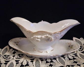 Antique. Porcelain sauce boat from the old days. Handmade. Base number 3295