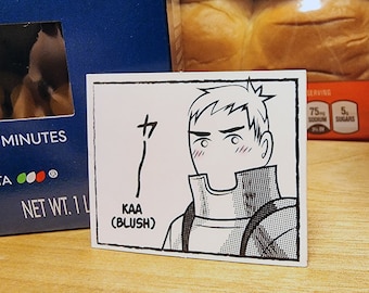 May include: A black and white illustration of a cartoon character with a blush on their cheeks. The character has short, spiky hair and is wearing a collared shirt. The text "KAA (BLUSH)" is written below the character. The Japanese character "サ" is written to the left of the character.