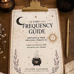 May include: A clipboard with a printed guide titled "The Expanded Frequency Guide" featuring a crescent moon, sun, and cauldron illustration. A lit candle, a pen, and a mug are also visible, creating a mystical aesthetic.