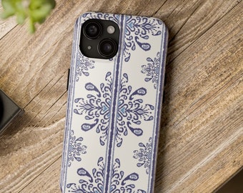 May include: A white phone case with a blue and white paisley pattern. The case has a camera cutout on the back.