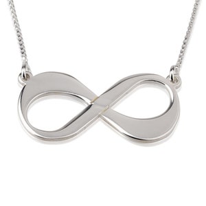 May include: A silver infinity symbol necklace with a delicate chain.