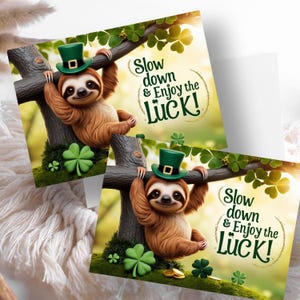 May include: Two greeting cards featuring a cartoon sloth wearing a green hat with a gold buckle. The sloth is hanging from a tree branch with green leaves. The text on the card reads "Slow down & Enjoy the Luck!"