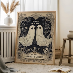 May include: A black and white illustration of two ghosts with floral details, surrounded by a decorative frame. The text "Til Death Do Us Part" is above the ghosts, and "Est. 2022 Janet & Jacob" is below.