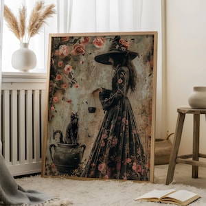 May include: A framed canvas print featuring a woman in a black witch's hat and dress, holding a cauldron. She is surrounded by pink roses and a black cat sits in a pot.
