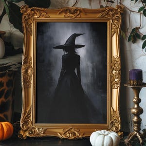 May include: A framed illustration of a witch in a black dress and pointed hat, standing in a dark, foggy forest. The frame is ornate and gold.