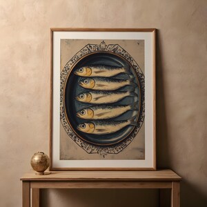 May include: A vintage print of a still life featuring five silver fish on a blue and white ceramic plate with a decorative border. The fish are arranged in a row, with their tails pointing towards the center of the plate.