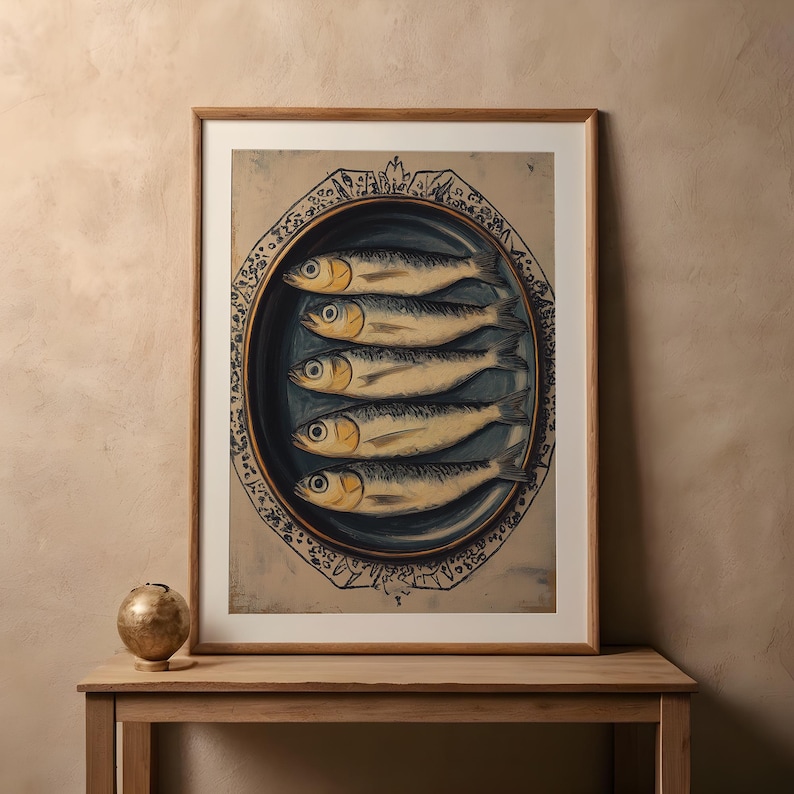 May include: A vintage print of a still life featuring five silver fish on a blue and white ceramic plate with a decorative border. The fish are arranged in a row, with their tails pointing towards the center of the plate.
