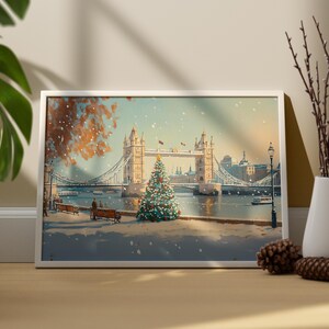 May include: A framed painting of a snowy scene with a Christmas tree in front of Tower Bridge in London. The bridge is decorated with lights and there are people walking across it.