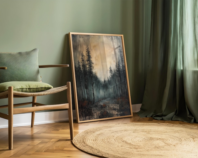 May include: A framed painting of a forest scene with tall trees and a misty background. The painting is in a wooden frame and is hanging on a green wall.
