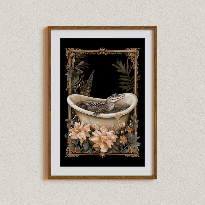 May include: A framed art print depicting an alligator in a bathtub. The artwork has a black background with a gold ornate frame and is surrounded by flowers and foliage. The alligator is in the tub, with its head above the water.