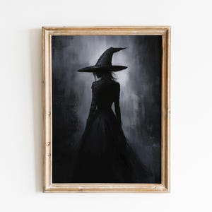 May include: A framed painting of a woman in a black dress and a large, pointed witch hat. The woman is standing in a dark, shadowy forest. The painting is done in a dark, moody style.