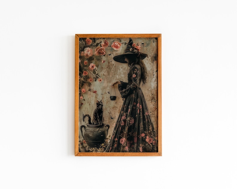 May include: A framed illustration of a witch in a black dress and a pointed hat, holding a scale. She is standing in front of a black cat sitting in a cauldron. The background is a floral pattern with pink roses.