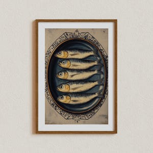 May include: A framed print of a vintage illustration of six silver fish arranged on a blue and white oval plate. The fish are arranged in a row, with their heads facing the viewer. The plate is decorated with a floral pattern.