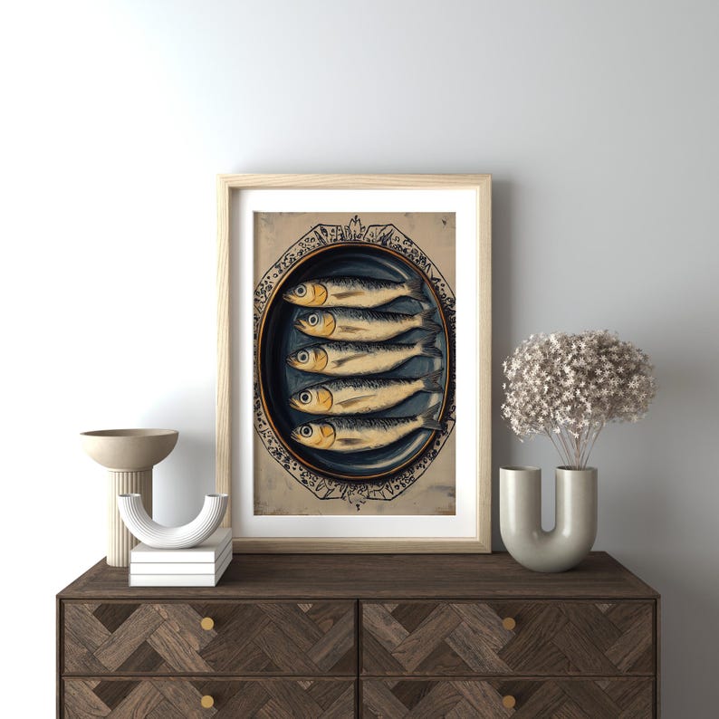 May include: A vintage illustration of a plate of sardines. The plate is decorated with a blue and white floral pattern. The sardines are arranged in a row, with their tails facing the viewer. The illustration is in a rustic style, with a faded background.