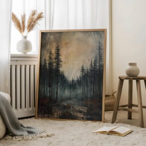 May include: A framed painting of a dark forest with a hazy, golden sky. The painting is in a wooden frame and is hanging on a white wall.