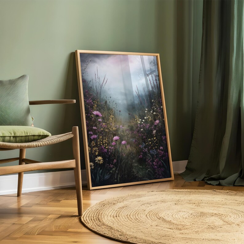 May include: A framed print of a misty forest scene with a path leading through a field of wildflowers. The flowers are in shades of pink, purple, and white. The background is a soft, hazy blue.