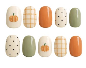 May include: A set of ten press-on nails featuring a variety of designs including cream backgrounds with orange pumpkins, tan plaid patterns, solid orange, cream with black polka dots, and solid sage green finishes in a glossy texture.
