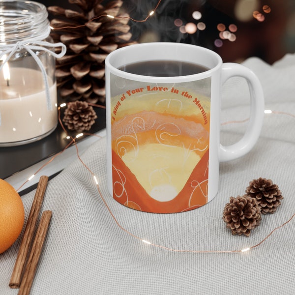I Sing of Your Love in the Morning, a declaration for the beginning of your day in this boho-style 11-ounce white ceramic mug