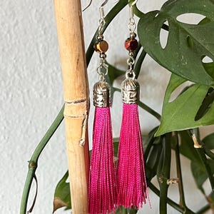Pink, and gold iridescent glass beads with pink tassel boho earrings