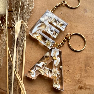 Keychain beige with dried flowers letters Gift idea Resin Trailer Letter pendant image 6