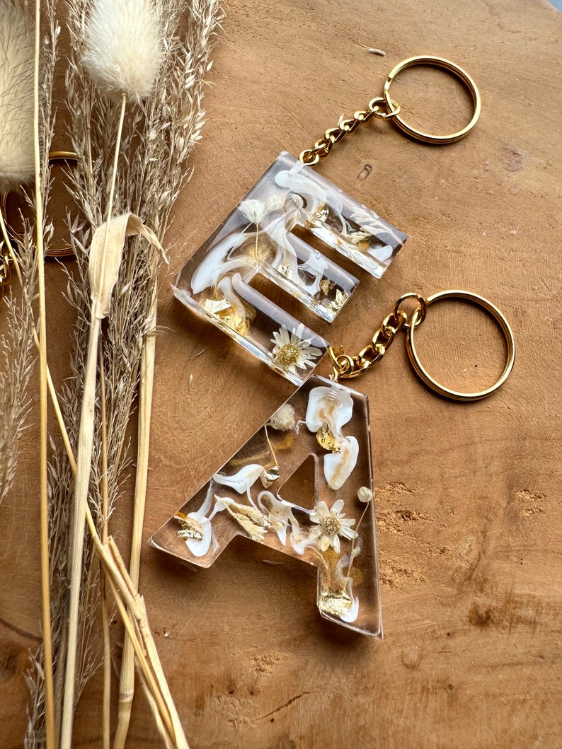 Keychain beige with dried flowers letters Gift idea Resin Trailer Letter pendant image 6