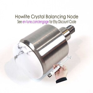 May include: A white howlite crystal balancing node with a silver metal base. The node is designed to be used with a tuning grip, which is not included in this image. The text "See en-tune.com/engage for Etsy Discount Code" is visible on the image.