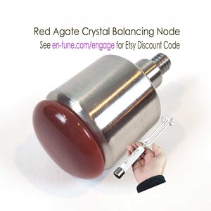 May include: Red agate crystal balancing node for en∞Tune Harmony Tuning Grips. The node is made of metal and has a red agate crystal on top. See en-tune.com/engage for Etsy discount code.