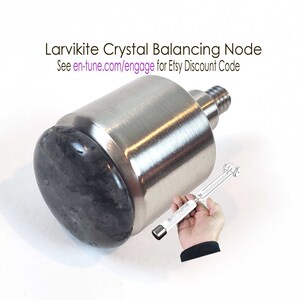 May include: A silver Larvikite Crystal Balancing Node with a dark gray crystal top. The node is designed to be used with en∞Tune Harmony Tuning Grips. See en-tune.com/engage for an Etsy discount code.