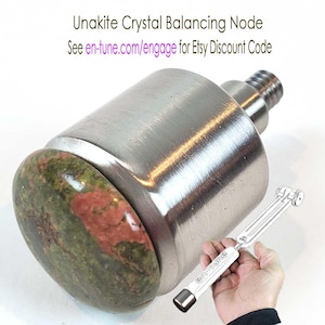 May include: A Unakite Crystal Node with a polished metal body and a green and red stone. The text on the image reads "Unakite Crystal Node Exclusively For en∞Tune Harmony Tuning Grips". A tuning grip is also in the image.