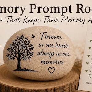 May include: A Memory Prompt Rock with the text "Forever in our hearts, always in our memories" and a tree design. Includes a card with memory prompts and a lit candle.