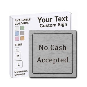 May include: A square grey sign with a wood grain texture featuring the black text No Cash Accepted. Behind it, a white product box displays the text Your Text Custom Sign, along with a grid of available colour swatches and size options S, M, and L.