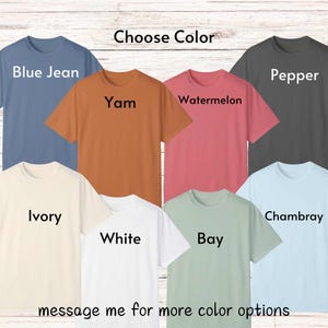 May include: A selection of t-shirts in various colors, including blue jean, pepper, yam, watermelon, ivory, white, bay, and chambray. The text "Choose Color" is at the top of the image. The text "message me for more color options" is at the bottom of the image.