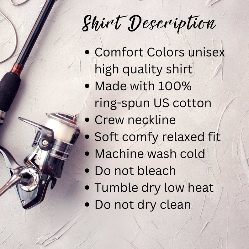May include: A close-up of a fishing reel and rod, with text describing a unisex shirt made from 100% ring-spun US cotton. The shirt features a crew neckline, a relaxed fit, and is machine washable.