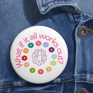 May include: White button with a pink circle and the text "What if it all works out?" in pink. A stick figure is jumping inside the circle, surrounded by colorful flowers.
